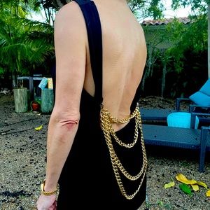 ASOS Jet black loose tank with gold chains on back.